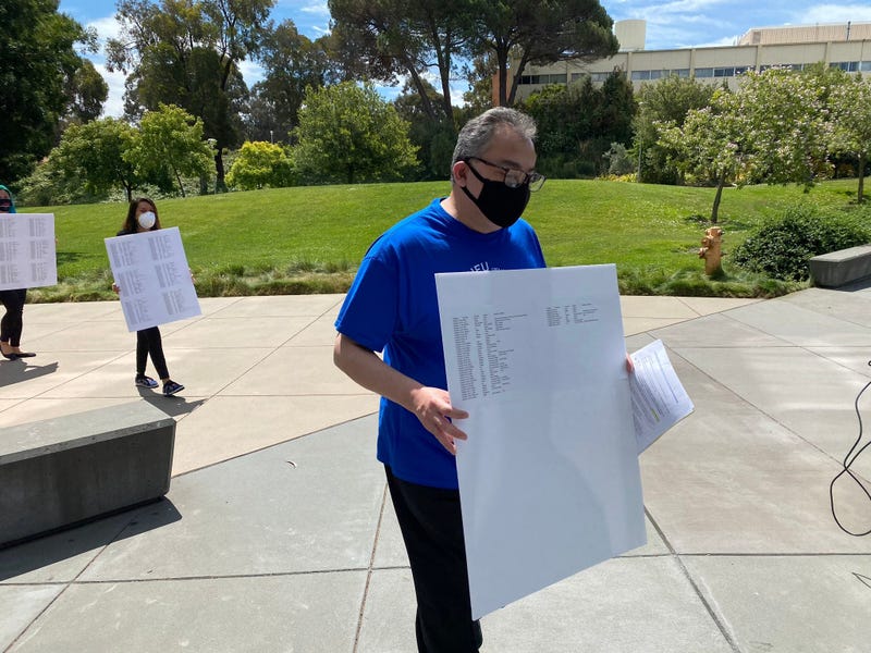 Union reps deliver a petition of over 1,000 signatures to CSU East Bay administrators.