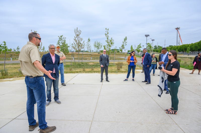 Public officials and others at the site of the new Kramer Hill Waterfront Park.
