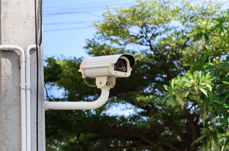 a security camera mounted on exterior of building