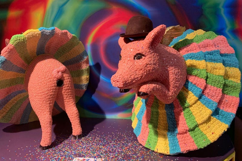 A candy sculpture of ballerina pigs.