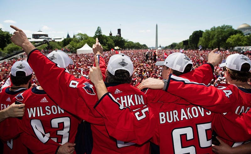 The Capitals embrace in front of 500,000 fans on the National Mall.