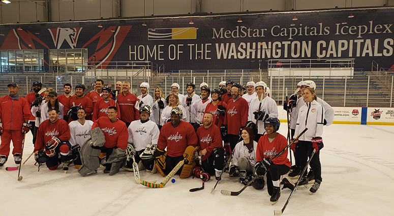 The assembled D.C. sports media take a team photo