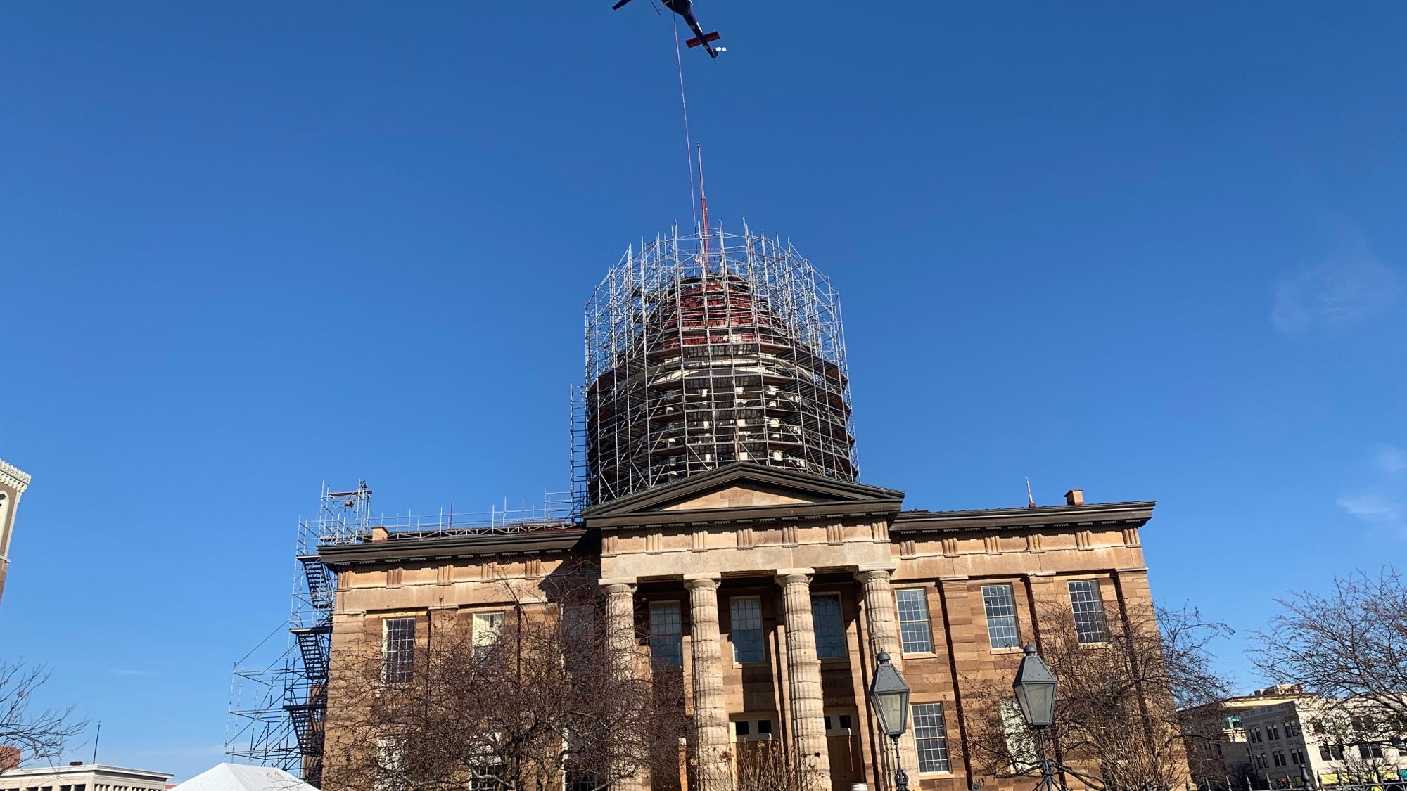 Helicopter pulls piece off Old State Capitol, by design
