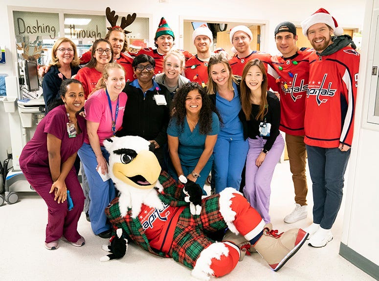 The Washington Capitals pose with MedStar Georgetown University Hospital staff.