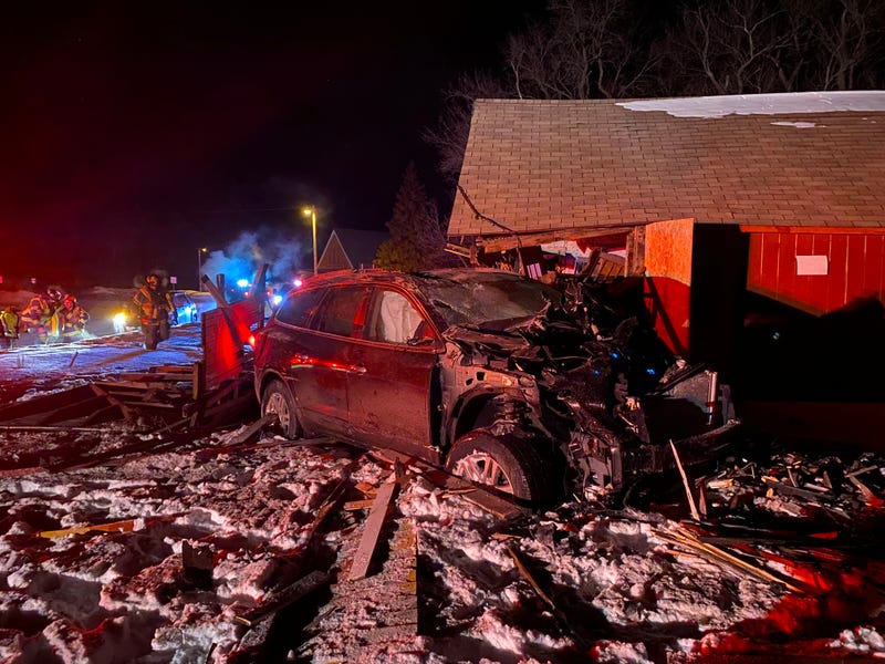 A woman was arrested after crashing her car into a house west of Gaylord