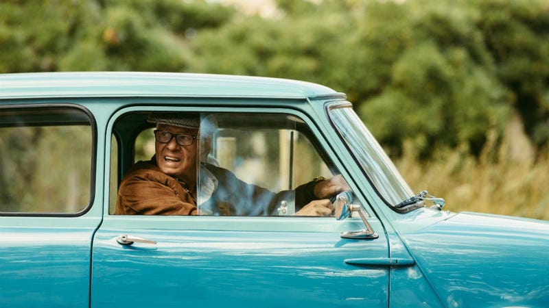 blue car old man driving