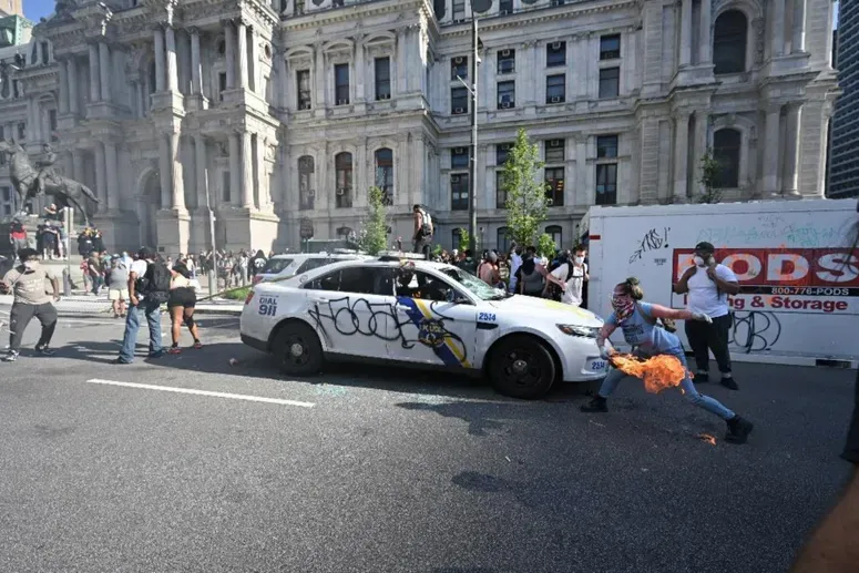 Lore Blumenthal, the woman who set fire to two Philadelphia police cars during civil unrest on May 30, 2020, (pictured above), was sentenced to 30 months behind bars on July 28, 2022 — 25 of which she has already served.