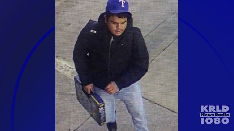 Arlington police release photos of suspect wanted in a carjacking