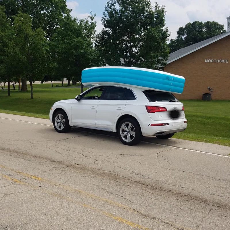 A woman is charged with child endangerment after transporting a pool with children in it atop of her vehicle.