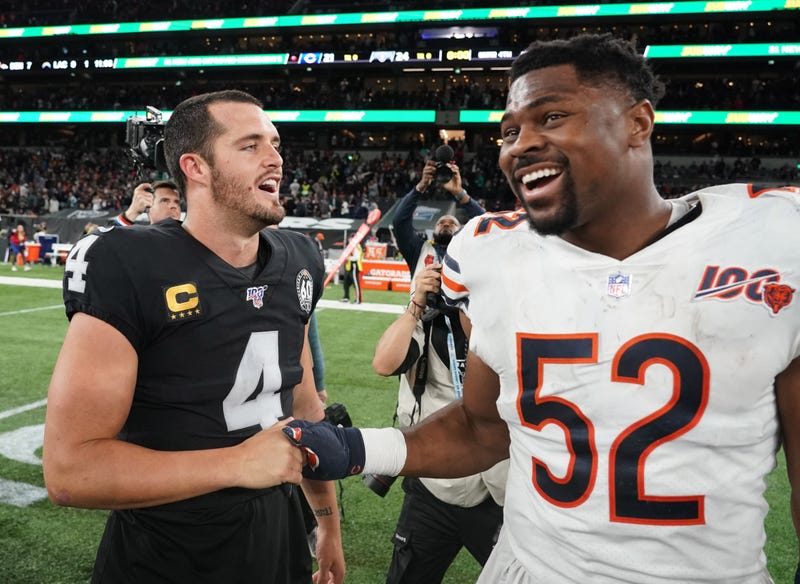 Derek Carr greets former Raiders teammate Khalil Mack. 