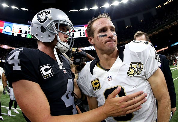 Derek Carr greets Drew Brees after a game. 