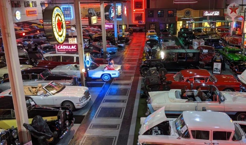 classic cars parked in a showroom