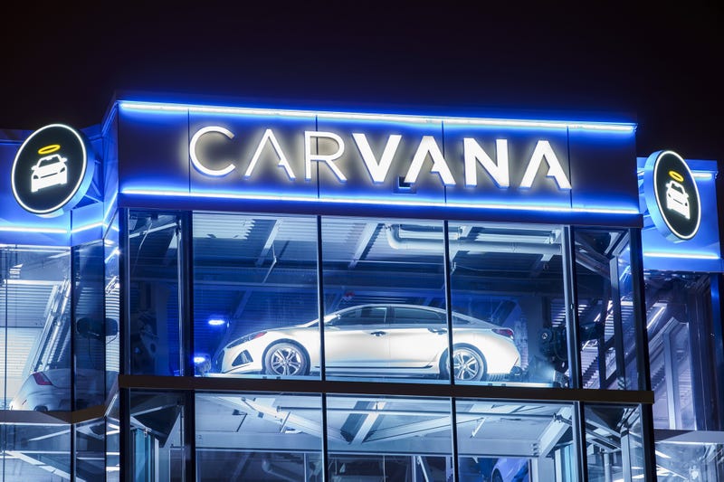 Carvana tower illuminated at night