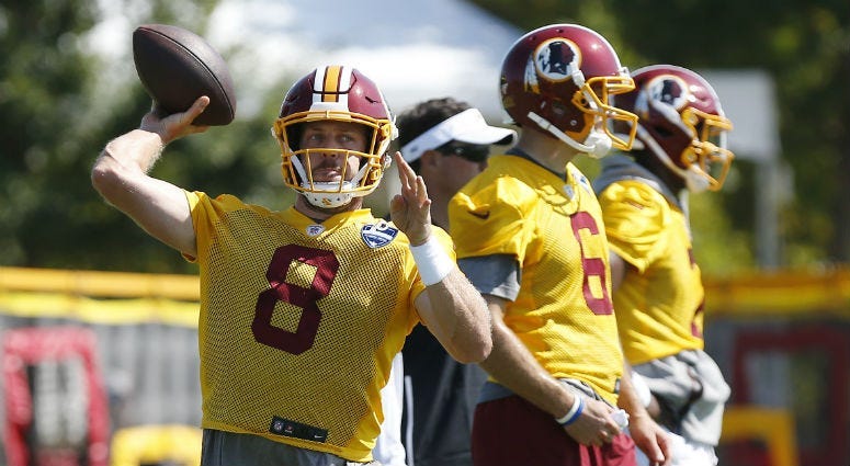 Redskins QB Case Keenum makes a throw at training camp. 