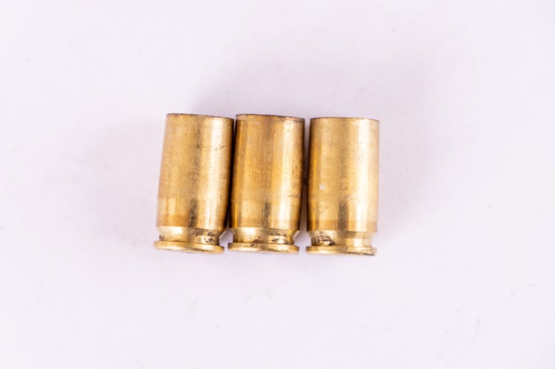 Three spent 9mm bullet casings