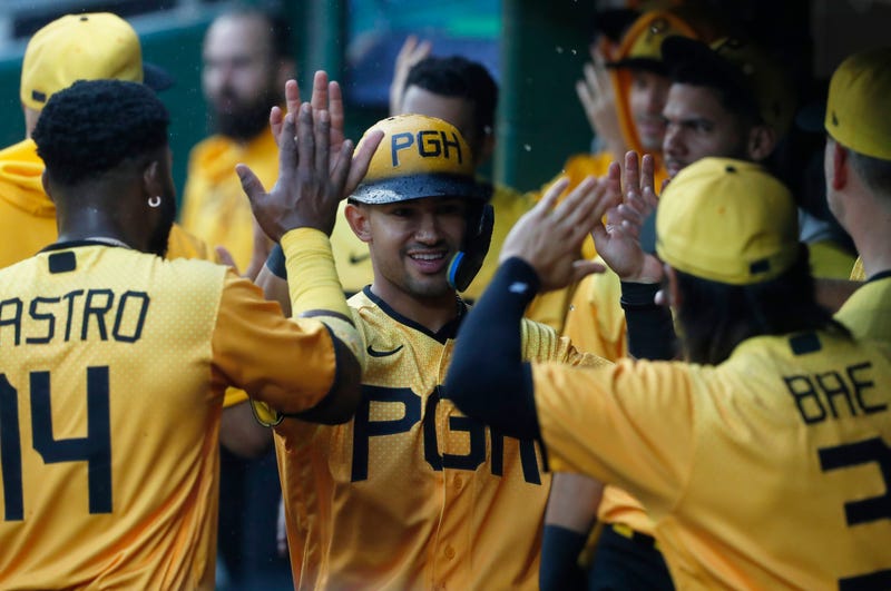 Nick Gonzales (39) reacts in the dugout after scoring against the Padres