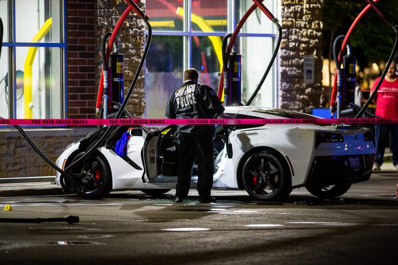 Police investigate a shooting at a vacuum stall of the Fuller’s Express $3 Car Wash at 2146 S. Rockwell St.