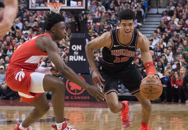 Bulls forward Chandler Hutchison (15) drives as Raptors forward OG Anunoby (3) defends.