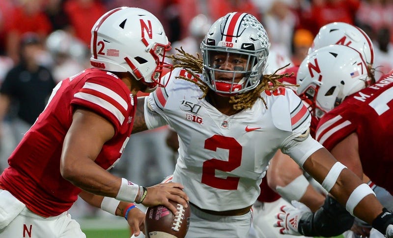 Ohio State defensive end Chase Young (2) pressures Nebraska quarterback Adrian Martinez, left.