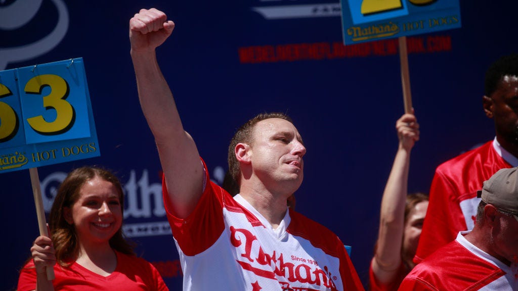 Joey Chestnut, hobbled on crutches, puts protestor in chokehold en route to win 15th Nathan's Hot Dog Eating Contest title