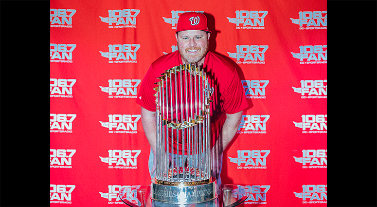 Senior 106.7 The Fan writer Chris Lingebach poses with the World Series Trophy