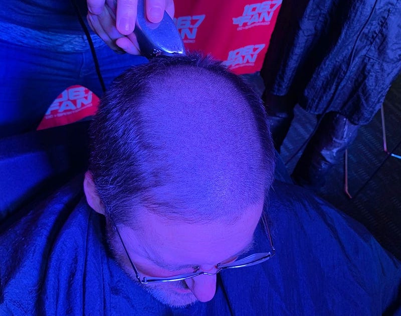 WJFK-FM’s Chris Russell with Danny Rouhier and Grant Paulsen. Russell lost a bet and then lost his hair on the air on Thursday, December 12. 