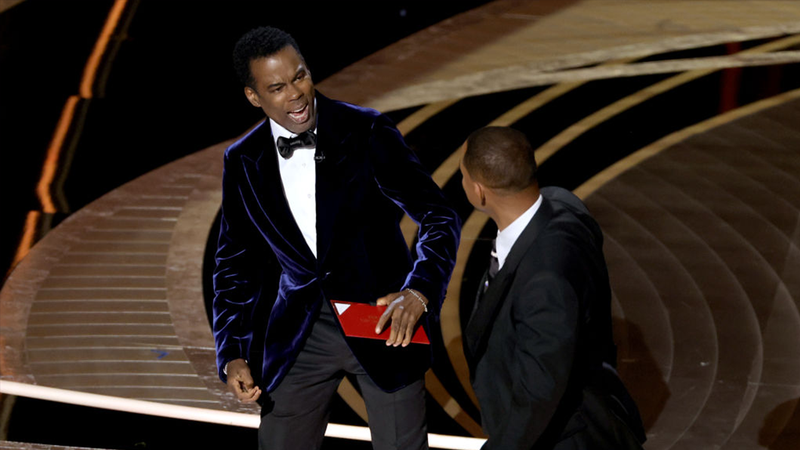 FILE - Will Smith appears to slap Chris Rock onstage during the 94th Annual Academy Awards at Dolby Theatre on March 27, 2022 in Los Angeles.