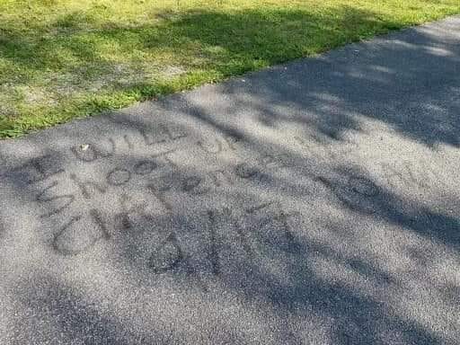 Threatening graffiti in Clarence