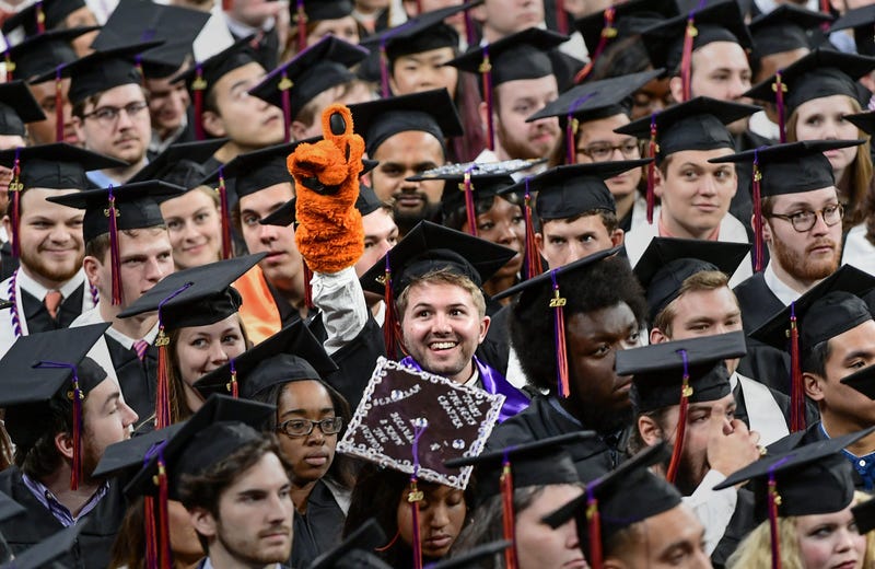 Former Tiger Cub mascot Nicholas Tourville of Fort Mill, Bachelor of Science in Bioengineering, points up with a tiger cub glove during Clemson University Fall graduation at Littlejohn Coliseum in Clemson Thursday, December 19, 2019. Clemson University Fa