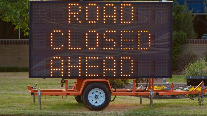 Photo of portable road closed ahead sign - stock photo