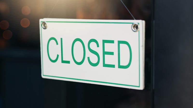 closed sign and front door for notice on board