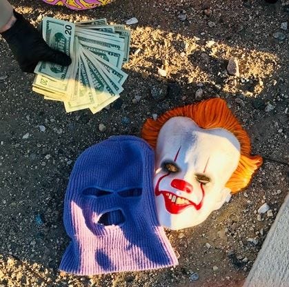 clown mask and money