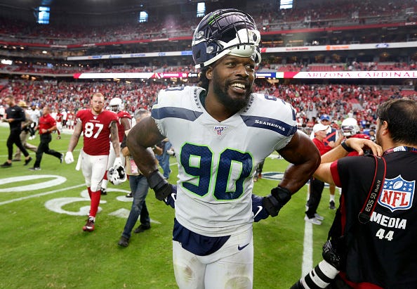 Jadeveon Clowney smiles after a Seahawks game against the Cardinals. 