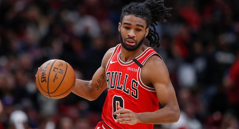 Bulls guard Coby White (0) brings the ball up court against the Wizards.