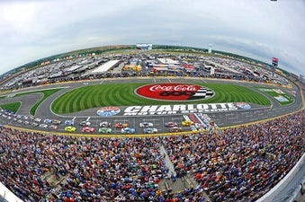 FILE - In this May 27, 2018, file photo, the field takes the green flag to start the NASCAR Cup Series auto race at Charlotte Motor Speedway in Concord, N.C. (AP Photo/Mike McCarn, file)