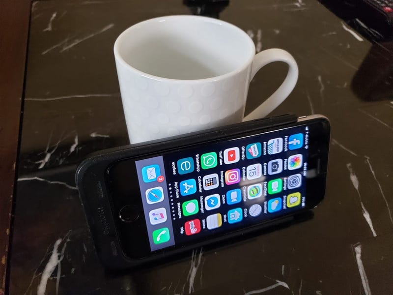 phone on coffee cup