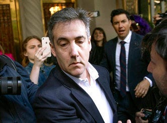 FILE - In this May 6, 2019, file photo, Michael Cohen, former attorney to President Donald Trump, leaves his apartment building before beginning his prison term in New York. (AP Photo/Kevin Hagen, File)