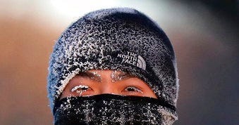 A runner wears the cold on his face while running along West River Parkway hills Thursday, Feb. 13, 2020, near downtown Minneapolis, with temperatures hovering near minus 30 degrees Fahrenheit with wind chills. (David Joles/Star Tribune via AP)