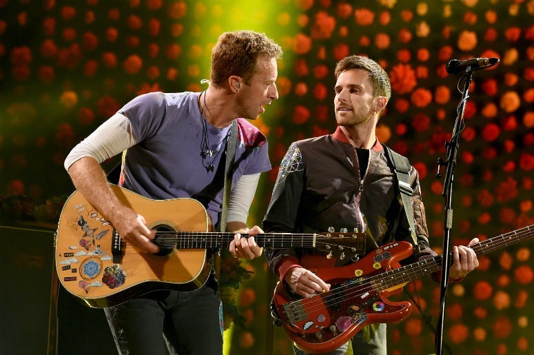 Chris Martin (L) and Guy Berryman of Coldplay perform at the Rose Bowl on October 6, 2017