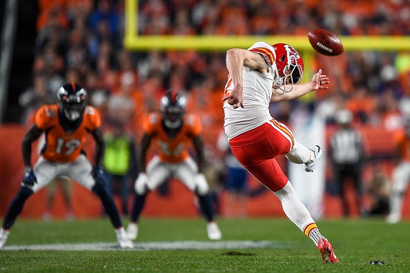 Dustin Colquitt kicks against the Broncos. 