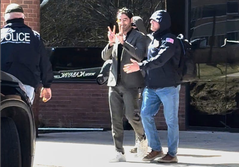This image taken from a video provided by Christopher Helali shows Mohsen Mahdawi, a Palestinian man who led protests against the war in Gaza as a student at Columbia University, being detained at the U.S. Citizenship and Immigration Services office in Colchester, Vt., on Monday, April 14, 2025