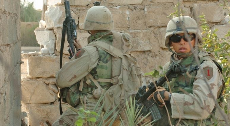 Soldiers from 1st Infantry Division, 3rd Brigade Reconnaissance Troop fight insurgents in Fallujah Iraq, Nov 2004 