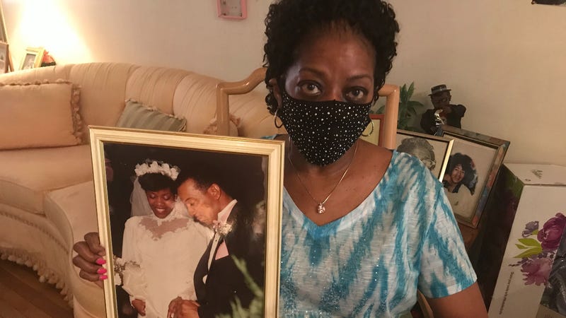 Connie Renfrow holds up a picture from her wedding day