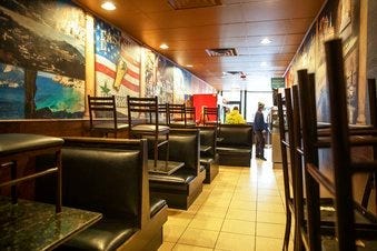 The dining section is closed off at East Side Pockets, a small restaurant near Brown University, Wednesday, March 25, 2020, in Providence, R.I. (AP Photo/David Goldman)
