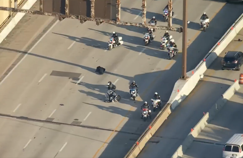 A police officer crashed their motorcycle into another officer’s bike during a police motorcade on I-95
