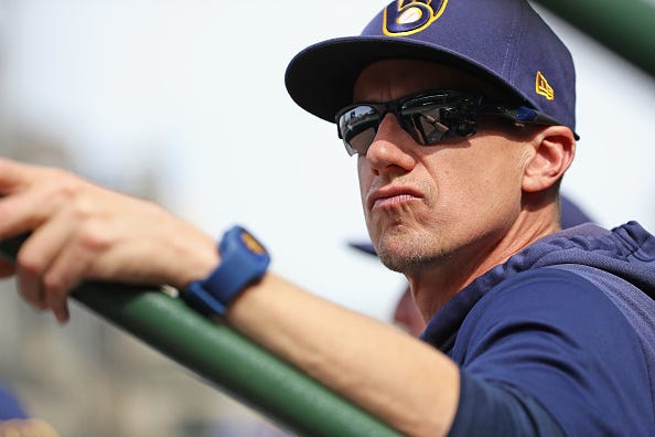 Brewers manager Craig Counsell looks on from the dugout. 