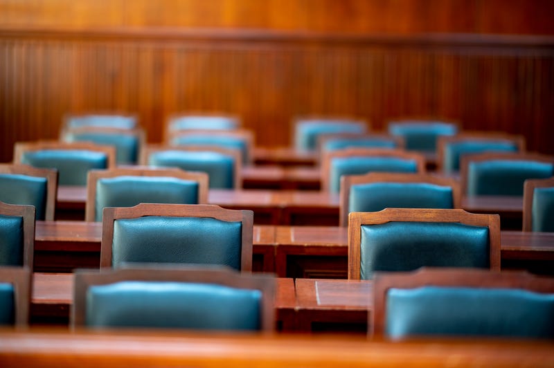 Chairs and wooden tables in the courtroom