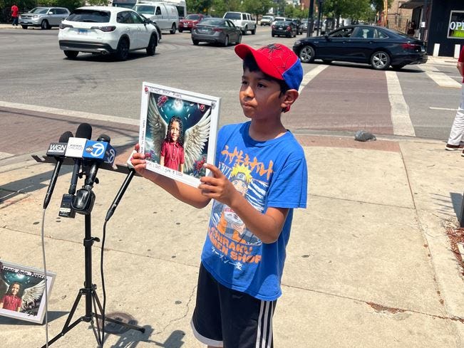 JaiMani's 10-year-old cousin Joel Rivera held up a photo of Jai’Mani