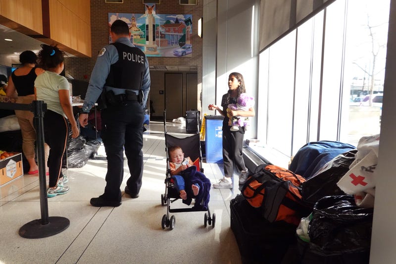 migrants in lobby of Chicago police station