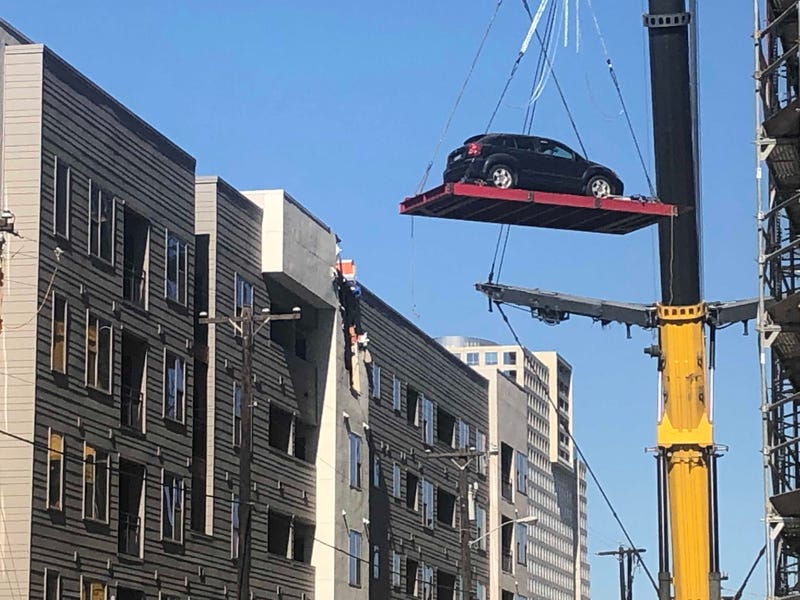 Cranes Remove Cars From Dallas Apartment Complex